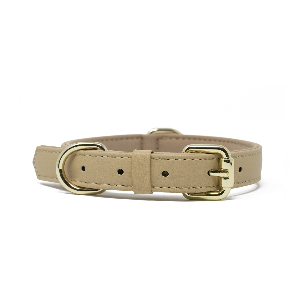 A Cream Beige vegan leather dog collar with silver-tone metal hardware, including a D-ring and buckle, shown against a plain white background.