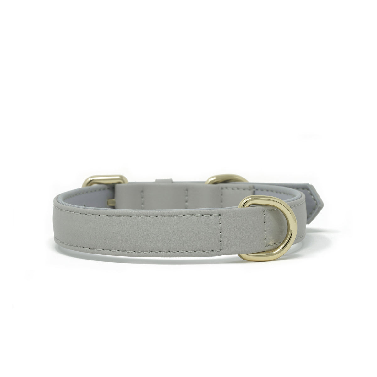 A Pearl Gray vegan leather dog collar with silver-tone metal hardware, including a D-ring and buckle, shown against a plain white background.
